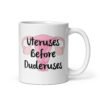White ceramic mug with image of a uterus and the text 'Uteruses before duderuses' printed on both sides.