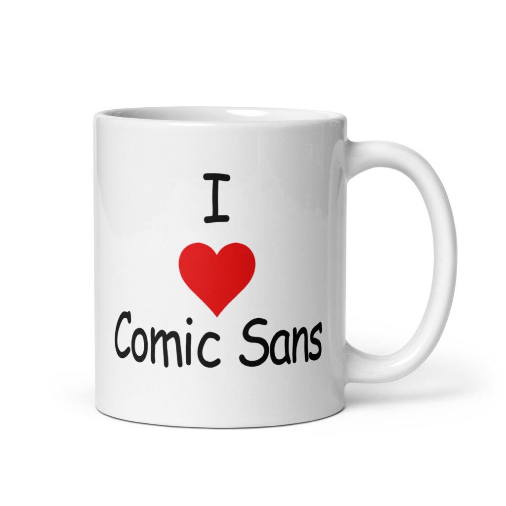 White ceramic mug with the text 'I ❤️Comic Sans' printed on both sides.