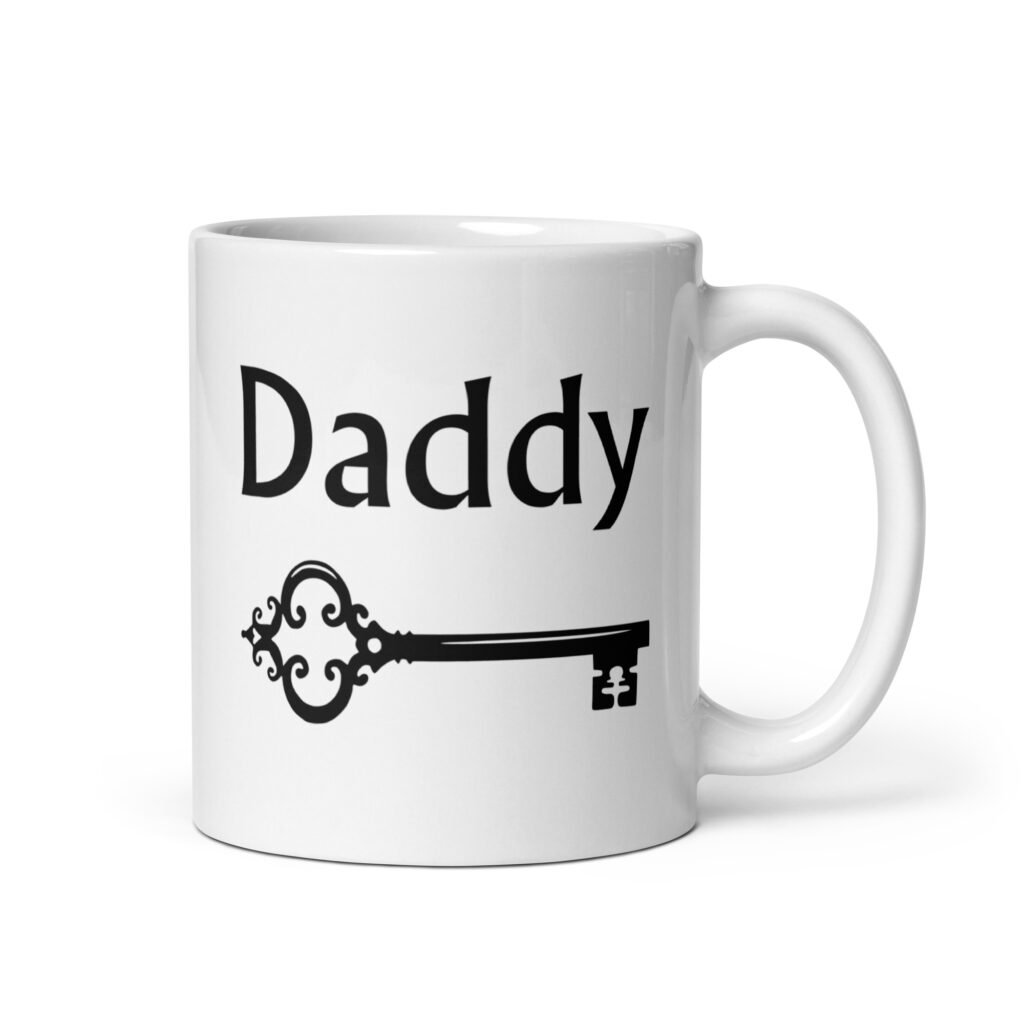 White ceramic coffee mug with an image of a key and the word 'Daddy' printed on both sides.