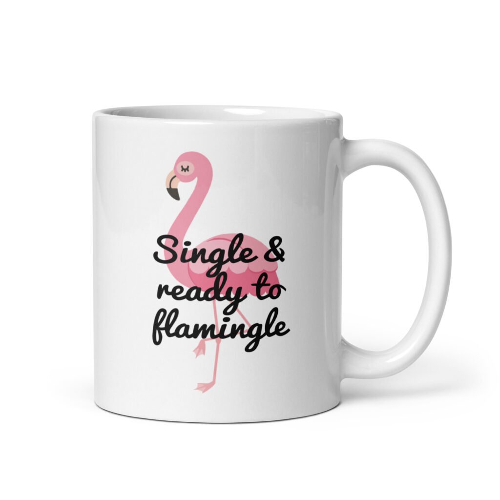 White ceramic coffee mug with an image of a flamingo and the text 'Single & ready to flamingle' printed on both sides.