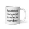 White ceramic coffee mug with the suggestive text 'Masturbation is a touchy subject, but oral sex is a matter of taste.' printed on both sides.