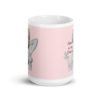 Pink and white ceramic coffee mug with an image of a retro black & white pin-up model and the text 'Satan is my Daddy' printed on both sides.