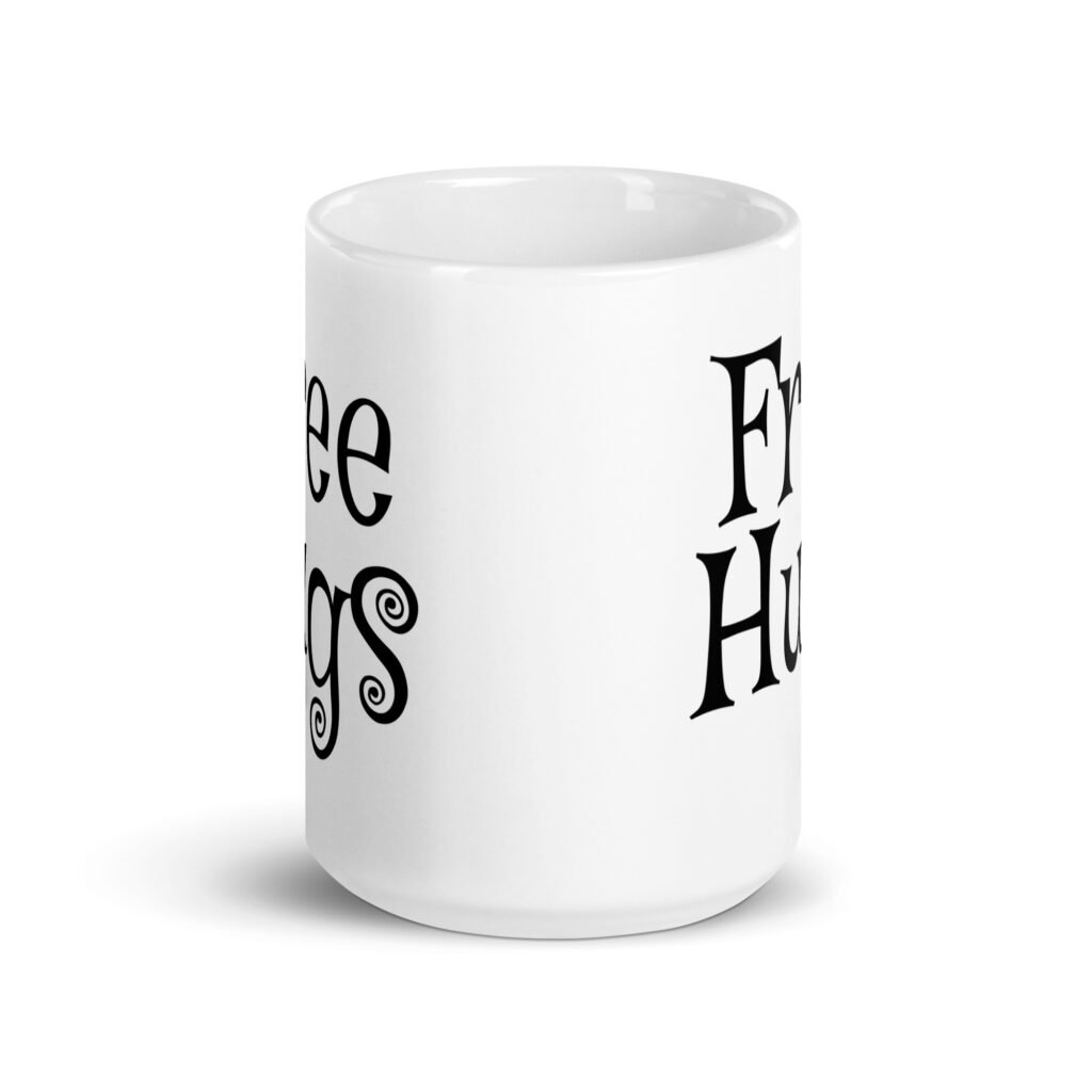 White ceramic coffee mug with the text 'Free Hugs' printed on both sides.