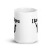White ceramic coffee mug that has an image of a silhouette of a cat and the text 'I knead you' printed on both sides of the mug.