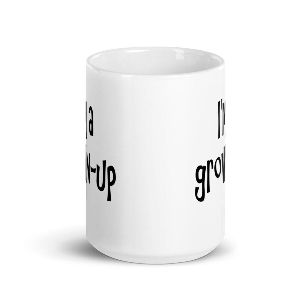 White ceramic coffee mug with the text 'I'm a grown-up' printed on both sides.