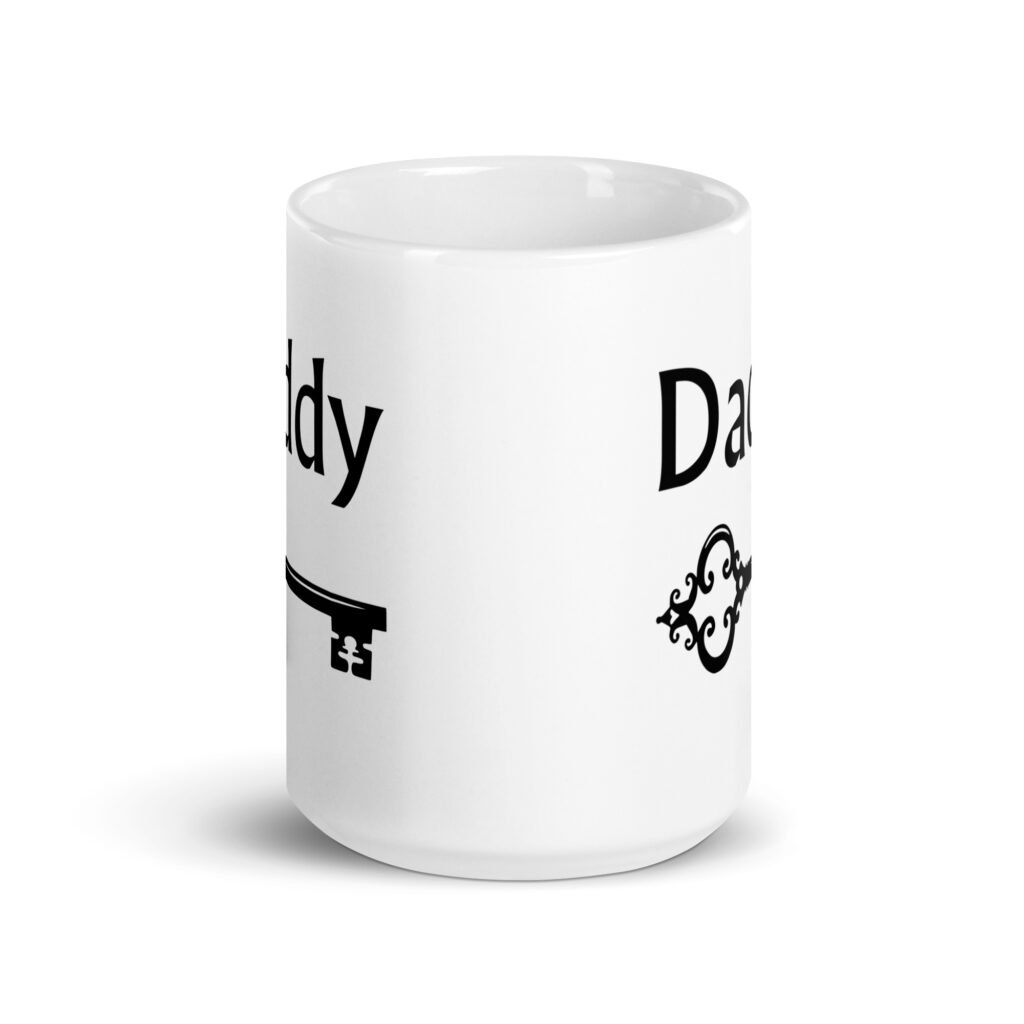 White ceramic coffee mug with an image of a key and the word 'Daddy' printed on both sides.
