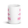 White ceramic coffee mug with the text 'Fuck your feelings' printed on both sides in pink. There are cute pink hearts next to the words.