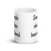 White ceramic coffee mug with the text 'Some people should have been swallowed' printed on both sides.