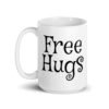 White ceramic coffee mug with the text 'Free Hugs' printed on both sides.