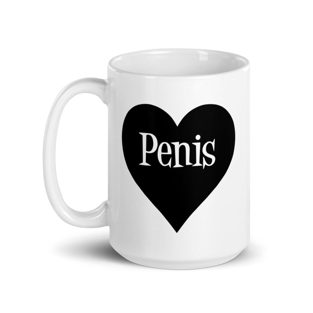 White ceramic coffee mug with a heart image printed on both sides. The word 'Penis' is inside the heart.