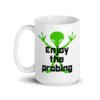 White ceramic coffee mug with an image of a green alien and the text 'Enjoy the probing' printed on both sides of the mug.