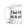 White ceramic coffee mug with the text 'A bound body frees the mind' printed on both sides.