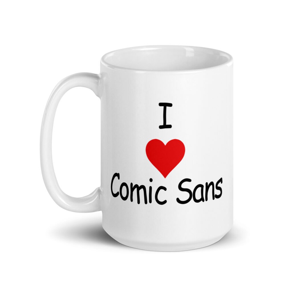 White ceramic mug with the text 'I ❤️Comic Sans' printed on both sides.