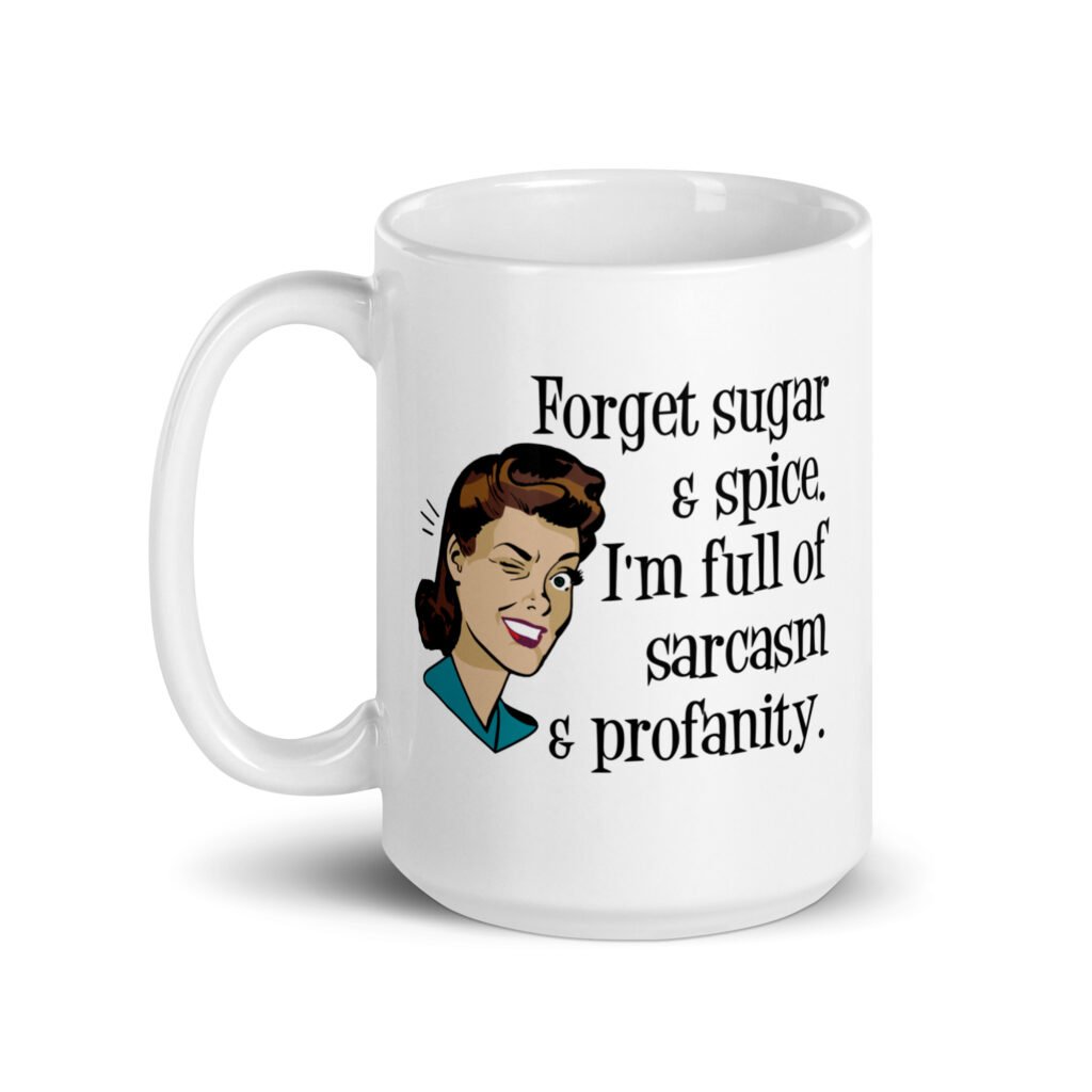 White ceramic coffee mug with image of winking retro woman and the text 'Forget sugar & spice. I'm full of sarcasm & profanity.' printed on both sides.