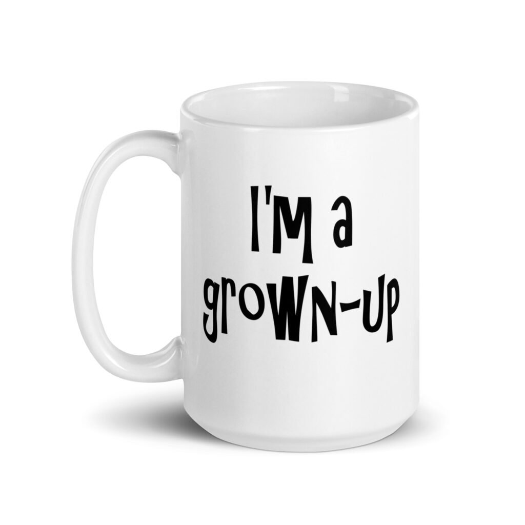 White ceramic coffee mug with the text 'I'm a grown-up' printed on both sides.