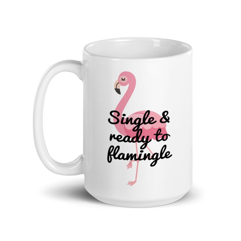 White ceramic coffee mug with an image of a flamingo and the text 'Single & ready to flamingle' printed on both sides.