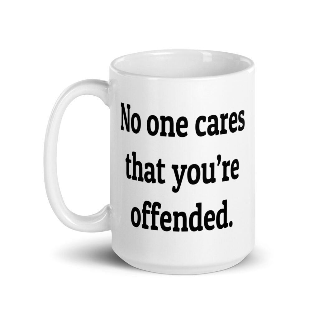 White ceramic coffee mug with the text "No one cares that you're offended.' printed on both sides.