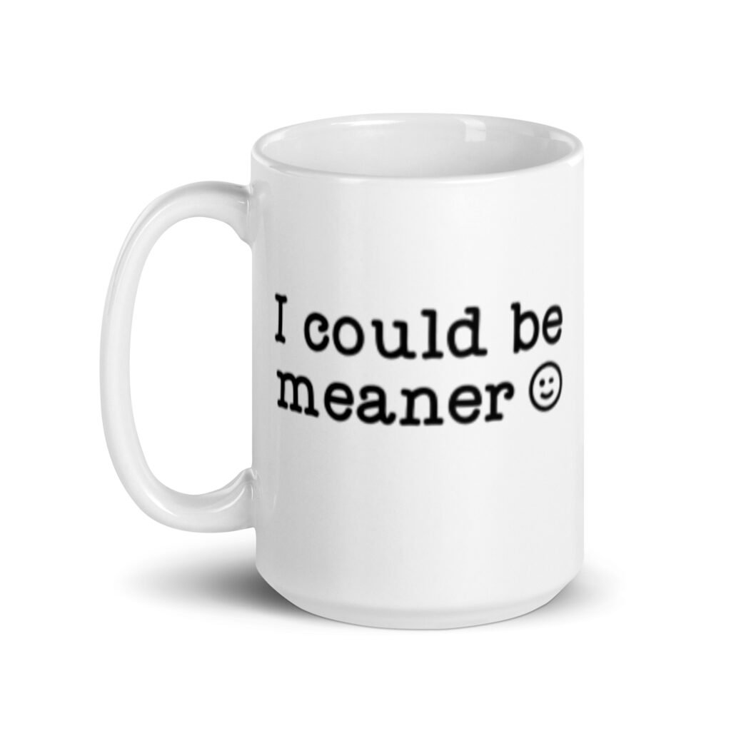 White ceramic mug with the text 'I could be meaner' printed on both sides.