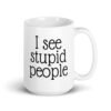 White ceramic coffee mug with the text 'I see stupid people' printed on both sides.