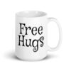 White ceramic coffee mug with the text 'Free Hugs' printed on both sides.
