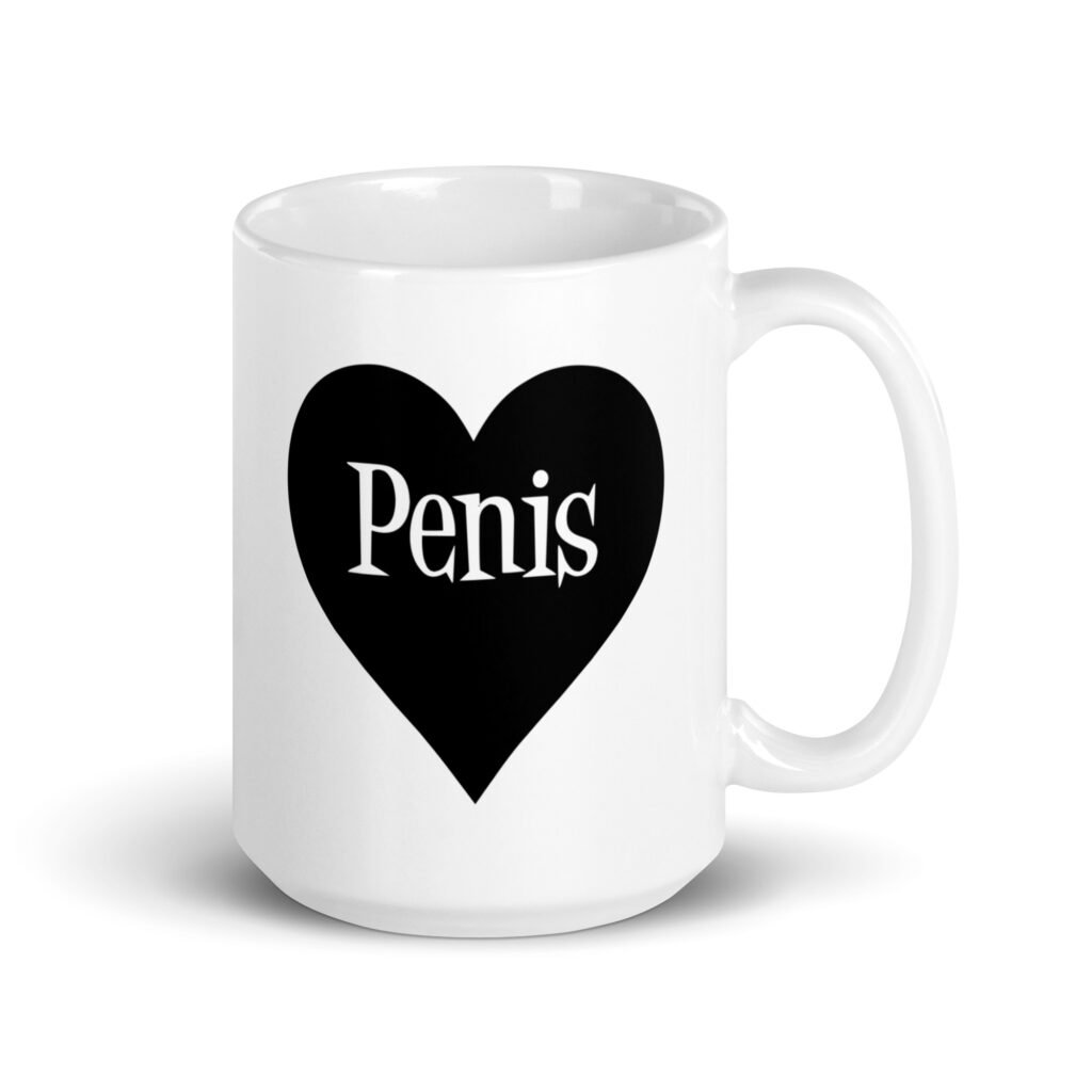 White ceramic coffee mug with a heart image printed on both sides. The word 'Penis' is inside the heart.