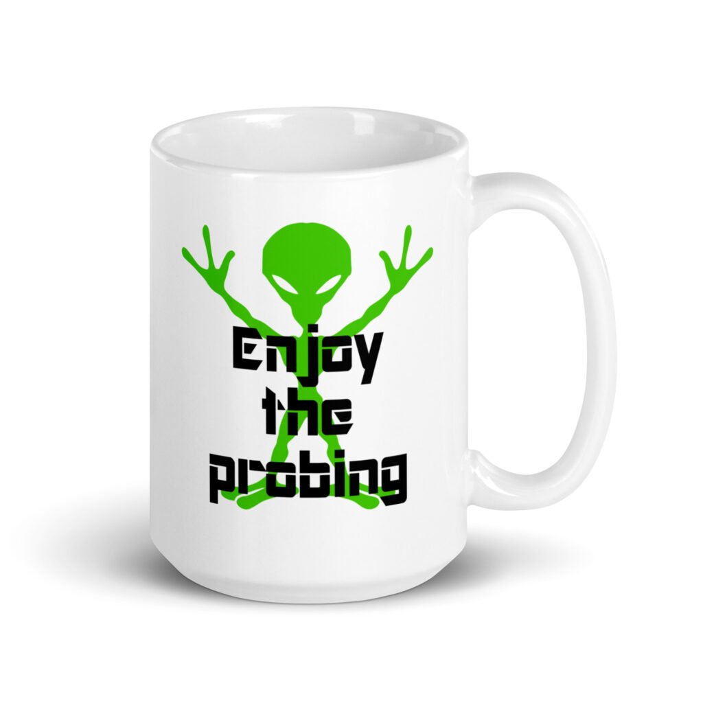 White ceramic coffee mug with an image of a green alien and the text 'Enjoy the probing' printed on both sides of the mug.