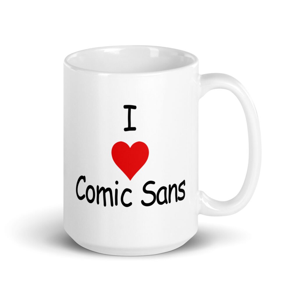 White ceramic mug with the text 'I ❤️Comic Sans' printed on both sides.