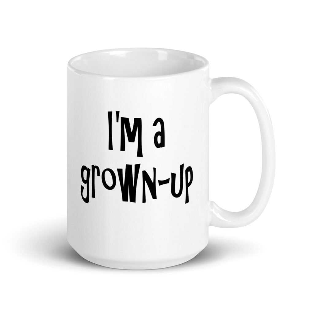 White ceramic coffee mug with the text 'I'm a grown-up' printed on both sides.