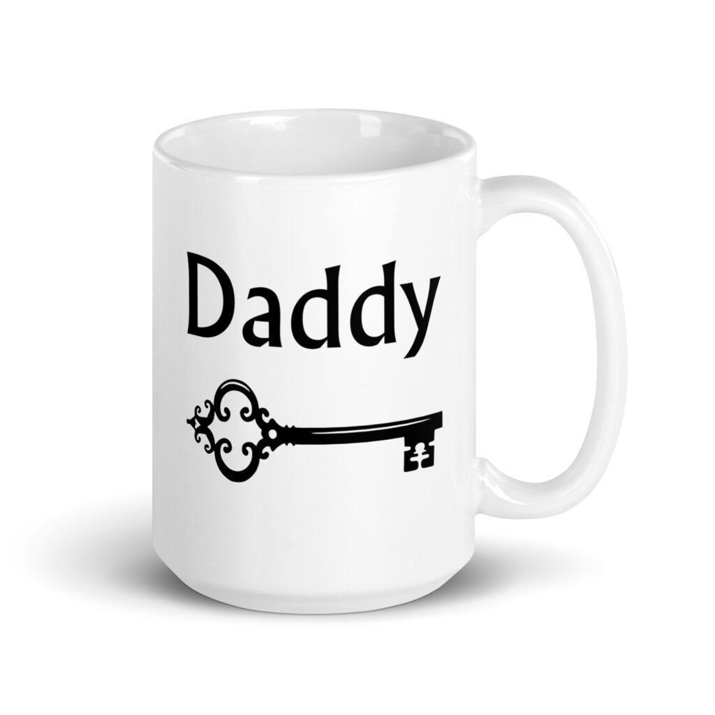 White ceramic coffee mug with an image of a key and the word 'Daddy' printed on both sides.