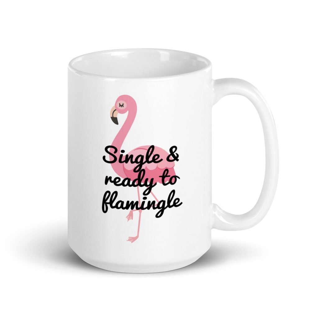 White ceramic coffee mug with an image of a flamingo and the text 'Single & ready to flamingle' printed on both sides.