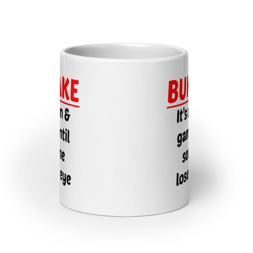 White ceramic mug with the text 'Bukkake. It's all fun & games until someone loses an eye' printed on both sides.