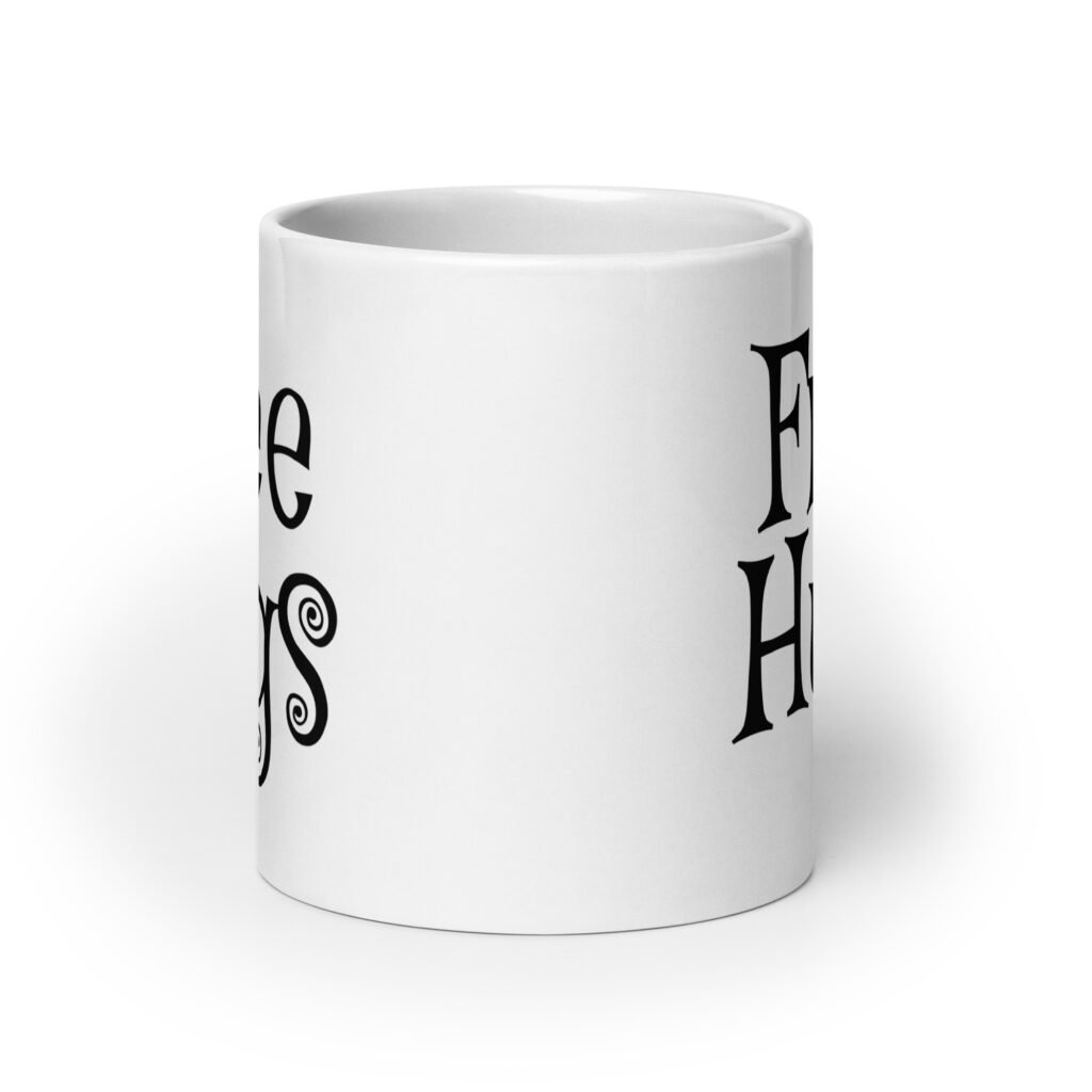 White ceramic coffee mug with the text 'Free Hugs' printed on both sides.