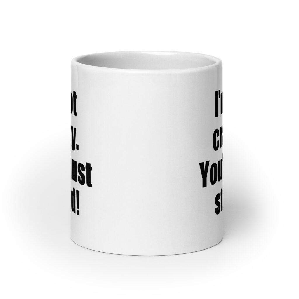 White ceramic coffee mug with the text 'I'm not cranky. You're just stupid!' printed on both sides.