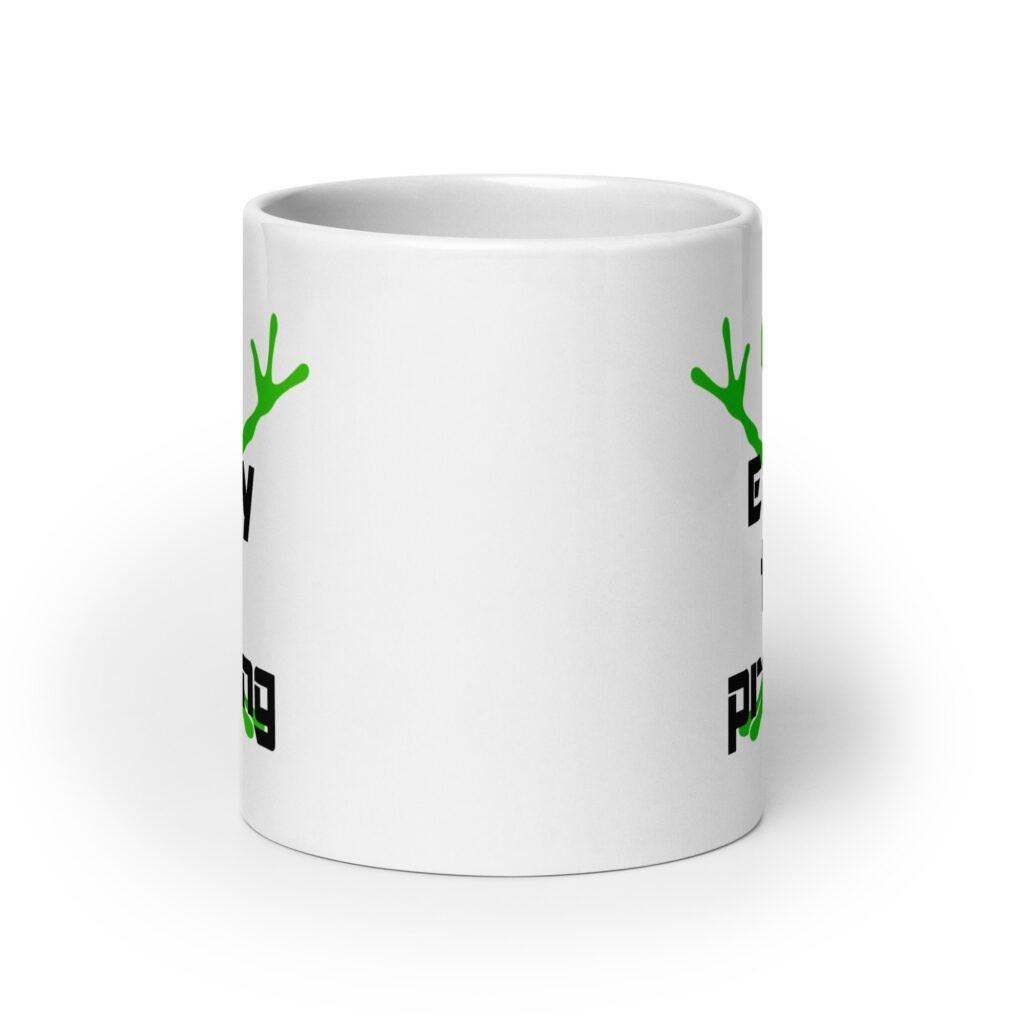 White ceramic coffee mug with an image of a green alien and the text 'Enjoy the probing' printed on both sides of the mug.