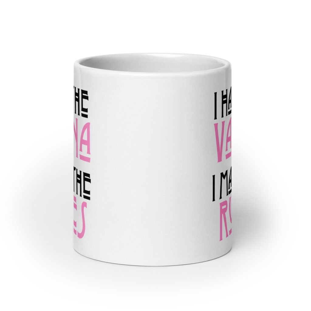 White ceramic coffee mug with the text 'I have the vagina. I make the rules' printed on both sides.