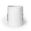 White ceramic coffee mug with an image of a flamingo and the text 'Single & ready to flamingle' printed on both sides.