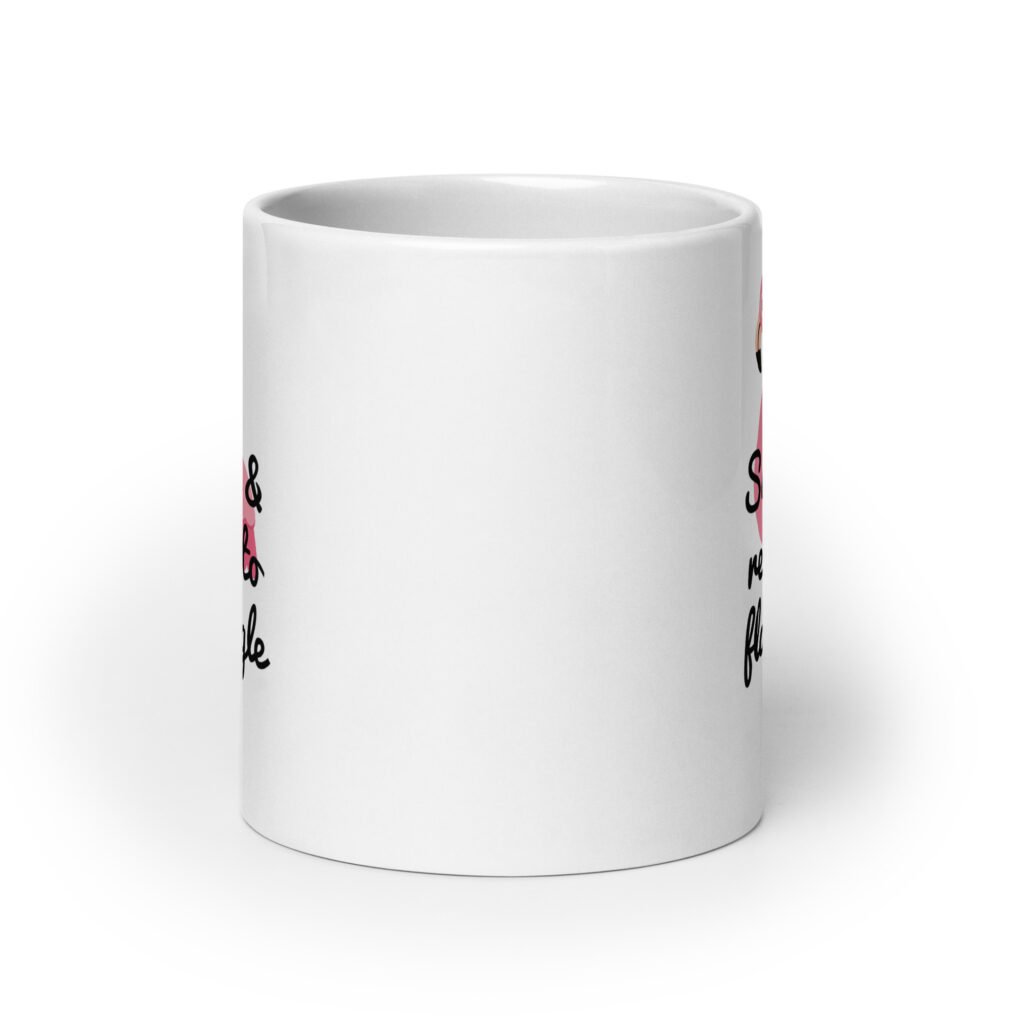 White ceramic coffee mug with an image of a flamingo and the text 'Single & ready to flamingle' printed on both sides.
