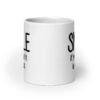 White ceramic mug with the text 'Smile if you take it in the ass' printed on both sides. The word 'smile' is large and the words 'take it in the ass' are much smaller.