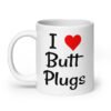 White ceramic coffee mug with the text 'I ❤️ Butt Plugs' printed on both sides.