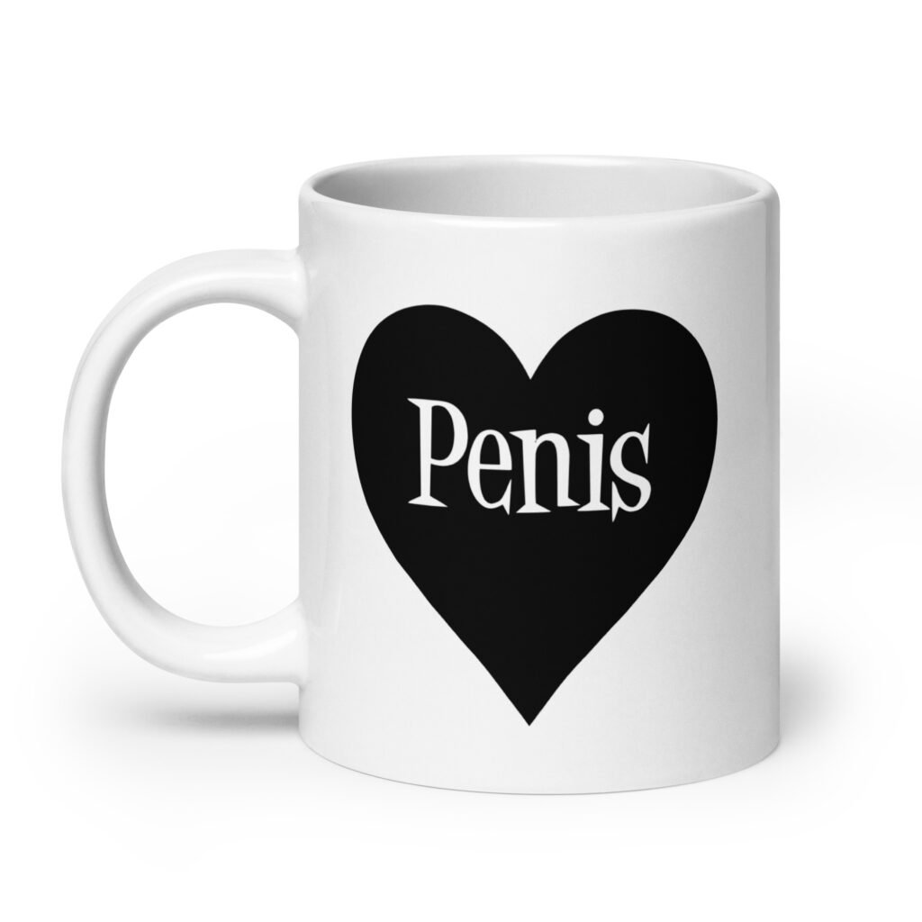 White ceramic coffee mug with a heart image printed on both sides. The word 'Penis' is inside the heart.