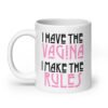 White ceramic coffee mug with the text 'I have the vagina. I make the rules' printed on both sides.