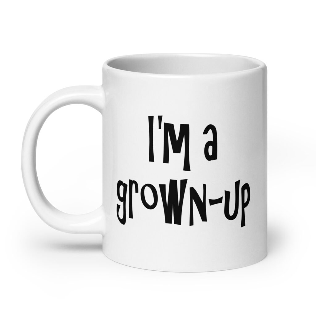White ceramic coffee mug with the text 'I'm a grown-up' printed on both sides.