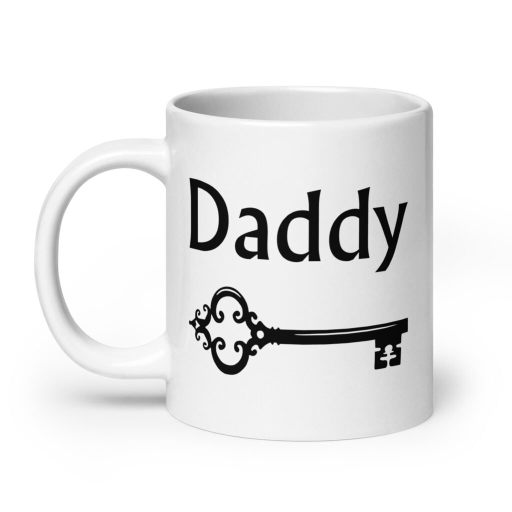 White ceramic coffee mug with an image of a key and the word 'Daddy' printed on both sides.