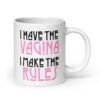 White ceramic coffee mug with the text 'I have the vagina. I make the rules' printed on both sides.