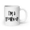 White ceramic coffee mug with the text 'I'm a grown-up' printed on both sides.
