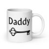 White ceramic coffee mug with an image of a key and the word 'Daddy' printed on both sides.