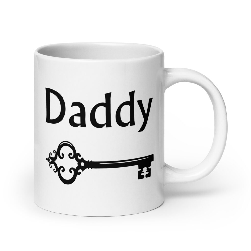 White ceramic coffee mug with an image of a key and the word 'Daddy' printed on both sides.