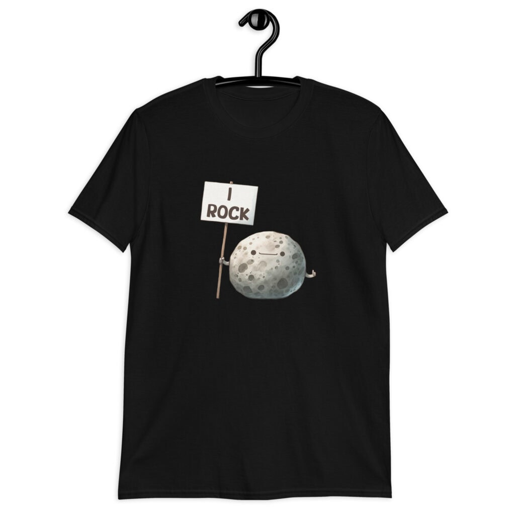 Black t-shirt that has an image of a grey rock that is holding a sign. The sign says 'I Rock.' The image is printed on the front of the shirt.