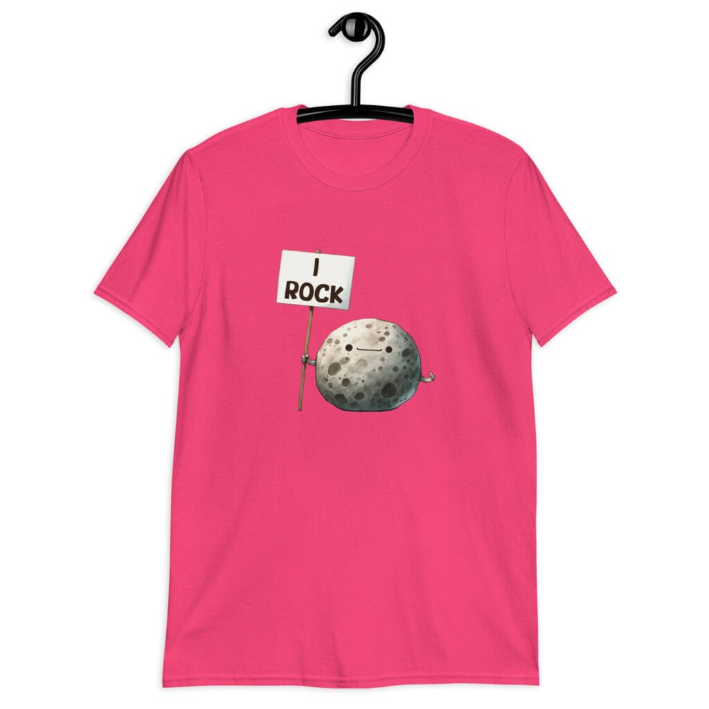 Heliconia pink t-shirt that has an image of a grey rock that is holding a sign. The sign says 'I Rock.' The image is printed on the front of the shirt.