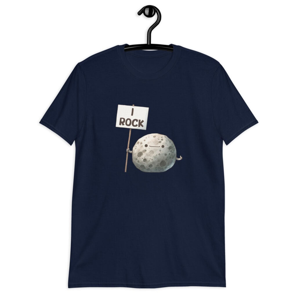 Navy blue t-shirt that has an image of a grey rock that is holding a sign. The sign says 'I Rock.' The image is printed on the front of the shirt.